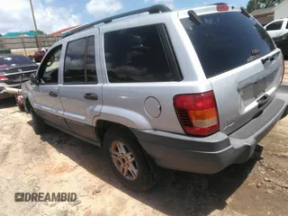 2004 Jeep Grand Cherokee Laredo z VIN 1J4GW48SX4C309998, wystawiony jako IAAI lot #42307167 z przebiegiem 306 912 mil mil oraz . Historia ofert i sprzedaży dostępna na DreamBid. Obrazek 3.