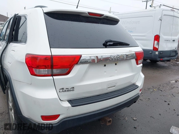 2013 Jeep Grand Cherokee Laredo with VIN 1C4RJFAG6DC557163, listed as a IAAI auction lot 42019052 with 125,058 mi miles. Bid and sale history available at carsss.com. Image 15.