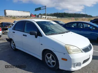 2006 Suzuki Aerio Premium z VIN JS2RA62S365300350, wystawiony jako IAAI lot #41492651 z przebiegiem 158 230 mil mil oraz . Historia ofert i sprzedaży dostępna na DreamBid. Obrazek 1.