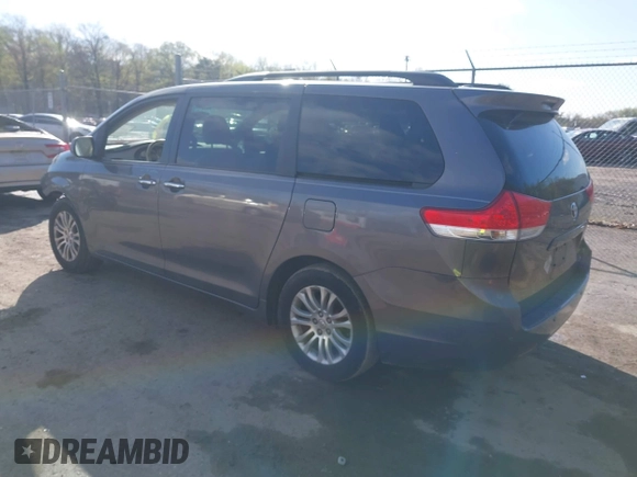 2014 Toyota Sienna XLE with VIN 5TDYK3DC5ES475750, listed as a IAAI auction lot 41976805 with 221,804 mi miles. Bid and sale history available at carsss.com. Image 3.