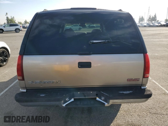 1999 GMC Suburban with VIN 3GKEC16R0XG526194, listed as a Copart auction lot 83740634 with 199,583 mi miles and Clean title. Bid and sale history available at DreamBid. Image 6.