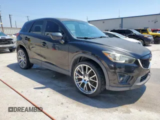 2014 Mazda CX-5 Touring with VIN JM3KE2CY5E0316077, listed as a Copart auction lot 58218735 with 190,789 mi miles and Salvage title. Bid and sale history available at DreamBid. Image 4.