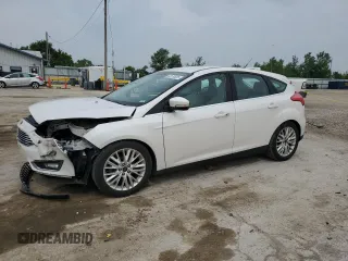 2016 Ford Focus Titanium with VIN 1FADP3N23GL345904, listed as a Copart auction lot 60139525 with 97,572 mi miles and Salvage title. Bid and sale history available at DreamBid. Image 1.