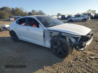 2023 Genesis G70 2.0T with VIN KMTG34TA1PU134120, listed as a Copart auction lot 77657374 with 12,024 mi miles and Salvage Title. Bid and sale history available at DreamBid. Image 4.