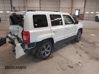 2014 Jeep Patriot Latitude with VIN 1C4NJPFA3ED739925, listed as a IAAI auction lot 41623546 with 130,374 mi miles and . Bid and sale history available at carsss.com. Image 4.