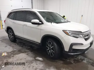 2019 Honda Pilot Touring 7-Passenger with VIN 5FNYF6H64KB005798, listed as a IAAI auction lot 41551933 with 103,151 mi miles. Bid and sale history available at carsss.com. Image 1.