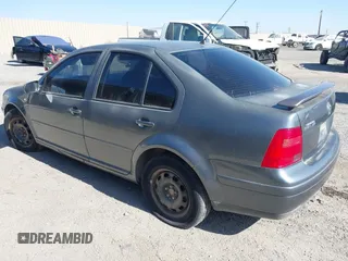 2003 Volkswagen Jetta GL z VIN 3VWRK69M43M117878, wystawiony jako IAAI lot #42553211 z przebiegiem 183 524 mil mil oraz . Historia ofert i sprzedaży dostępna na DreamBid. Obrazek 3.