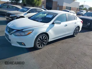 2018 Nissan Altima 2.5 S with VIN 1N4AL3AP8JC254733, listed as a IAAI auction lot 40212001 with 148,347 mi miles. Bid and sale history available at carsss.com. Image 2.