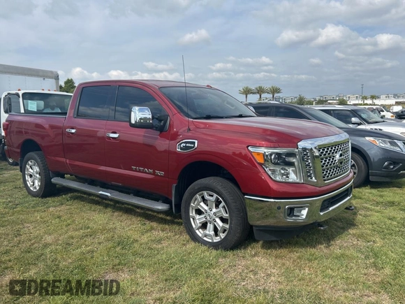 2016 Nissan Titan Platinum Reserve z VIN 1N6BA1F26GN512666, wystawiony jako Copart lot #54364115 z przebiegiem 120 182 mil mil oraz Czysty tytuł • Clean title. Historia ofert i sprzedaży dostępna na DreamBid. Obrazek 1.