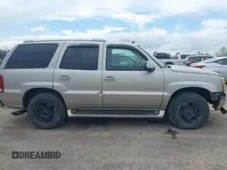 2004 Cadillac Escalade z VIN 1GYEK63N14R177291, wystawiony jako IAAI lot #42263535 z przebiegiem 170 550 mil mil oraz . Historia ofert i sprzedaży dostępna na DreamBid. Obrazek 13.