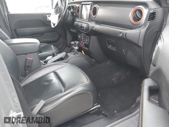 2022 Jeep Gladiator Mojave z VIN 1C6JJTEG8NL130971, wystawiony jako IAAI lot #41163074 z przebiegiem 47 142 mil mil oraz . Historia ofert i sprzedaży dostępna na DreamBid. Obrazek 5.