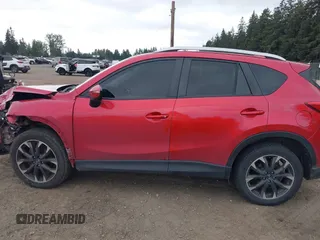 2016 Mazda CX-5 Grand Touring z VIN JM3KE4DY7G0687318, wystawiony jako IAAI lot #42228585 z przebiegiem 188 793 mil mil oraz . Historia ofert i sprzedaży dostępna na DreamBid. Obrazek 14.