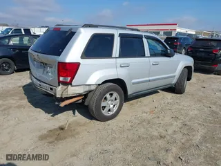 2010 Jeep Grand Cherokee Laredo with VIN 1J4PS4GK2AC155683, listed as a IAAI auction lot 41411133 with 211,803 mi miles. Bid and sale history available at carsss.com. Image 4.