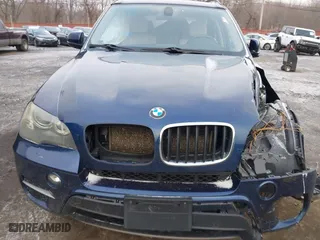 2011 BMW X5 35i with VIN 5UXZV4C54BL738262, listed as a IAAI auction lot 41633474 with 173,914 mi miles. Bid and sale history available at carsss.com. Image 6.