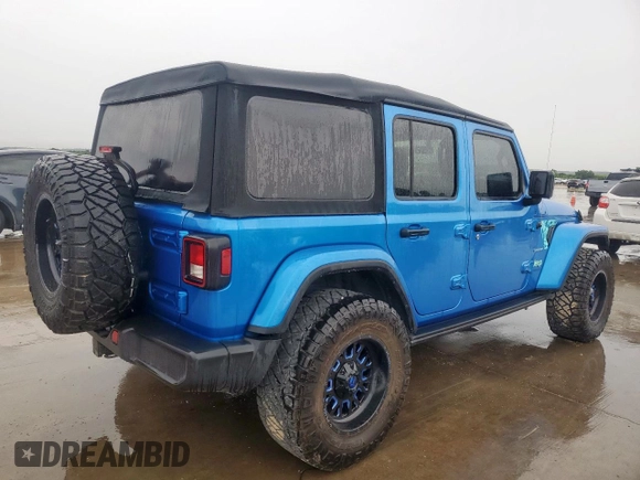 2023 Jeep Wrangler Sahara with VIN 1C4HJXEG7PW590252, listed as a Copart auction lot 59377765 with 32,689 mi miles and Salvage title. Bid and sale history available at DreamBid. Image 3.