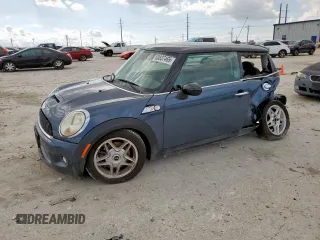 2010 MINI Hardtop S with VIN WMWMF7C51ATZ69061, listed as a Copart auction lot 60837465 with 102,506 mi miles and Salvage title. Bid and sale history available at DreamBid. Image 1.
