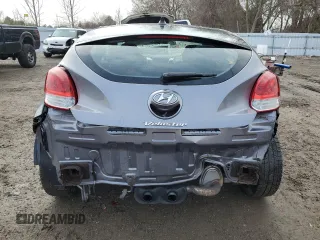 2012 Hyundai Veloster w/Black Int z VIN KMHTC6ADXCU025876, wystawiony jako Copart lot #50377835 z przebiegiem 185 181 mil mil oraz Czysty tytuł • Clean title. Historia ofert i sprzedaży dostępna na DreamBid. Obrazek 6.