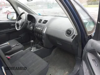 2010 Suzuki SX4 with VIN JS2YB5A37A6300142, listed as a IAAI auction lot 41956392 with 91,808 mi miles and . Bid and sale history available at DreamBid. Image 5.