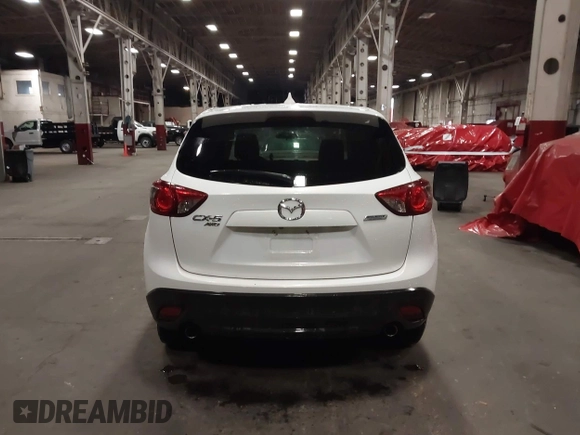 2016 Mazda CX-5 Touring z VIN JM3KE4CY0G0853261, wystawiony jako IAAI lot #41861176 z przebiegiem 63 491 mil mil oraz . Historia ofert i sprzedaży dostępna na DreamBid. Obrazek 16.