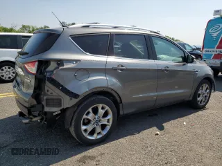 2014 Ford Escape Titanium с VIN 1FMCU0J96EUD41199, выставлен на аукционе Copart как лот 59380245 с пробегом 100 319 миль миль и Списание • Salvage title. История ставок и продаж доступна на DreamBid. Изображение 3.