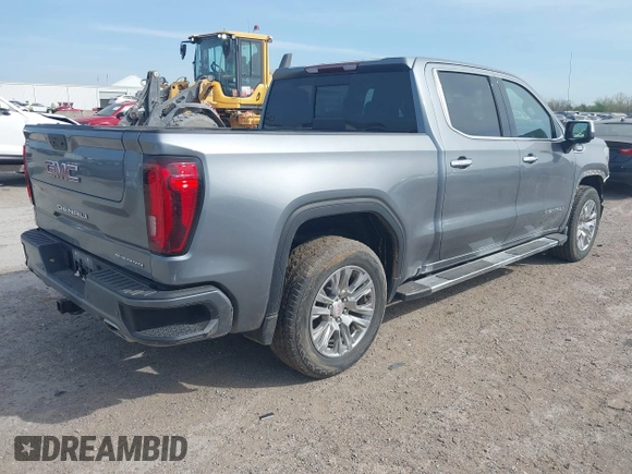 2021 GMC Sierra 1500 Denali z VIN 3GTU9FETXMG382438, wystawiony jako IAAI lot #41880365 z przebiegiem 54 651 mil mil oraz . Historia ofert i sprzedaży dostępna na DreamBid. Obrazek 4.