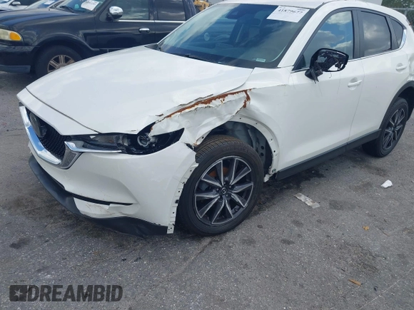 2018 Mazda CX-5 Touring z VIN JM3KFACM6J1419663, wystawiony jako IAAI lot #41879677 z przebiegiem 115 224 mil mil oraz . Historia ofert i sprzedaży dostępna na DreamBid. Obrazek 6.