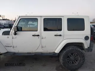 2010 Jeep Wrangler Unlimited Sahara with VIN 1J4BA5H15AL184376, listed as a IAAI auction lot 41270637 with 143,339 mi miles. Bid and sale history available at carsss.com. Image 14.