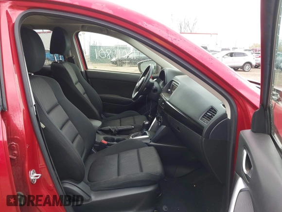 2014 Mazda CX-5 Touring z VIN JM3KE2CY3E0424892, wystawiony jako IAAI lot #42016801 z przebiegiem 173 350 mil mil oraz . Historia ofert i sprzedaży dostępna na DreamBid. Obrazek 5.