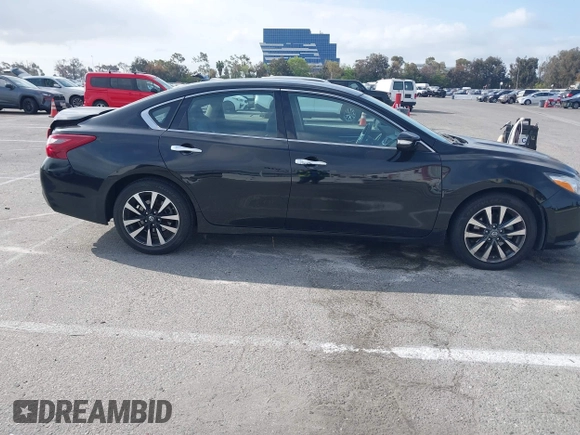 2018 Nissan Altima SR with VIN 1N4AL3AP7JC279459, listed as a IAAI auction lot 41901831 with 104,798 mi miles and . Bid and sale history available at DreamBid. Image 13.