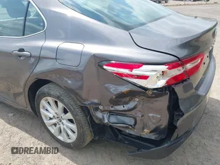2019 Toyota Camry LE with VIN 4T1B11HK9KU229110, listed as a IAAI auction lot 42133332 with 17,541 mi miles and . Bid and sale history available at DreamBid. Image 18.