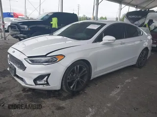 2019 Ford Fusion Titanium with VIN 3FA6P0K90KR236674, listed as a IAAI auction lot 42008633 with 99,737 mi miles and . Bid and sale history available at DreamBid. Image 2.