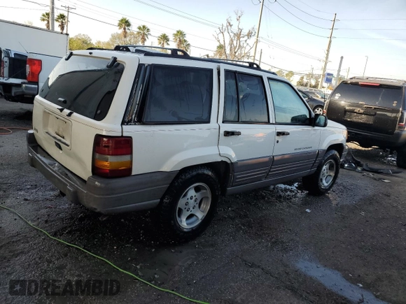 1997 Jeep Grand Cherokee TSi with VIN 1J4FX58S2VC612449, listed as a Copart auction lot 43532675 with 221,382 mi miles and Salvage Title. Bid and sale history available at carsss.com. Image 3.