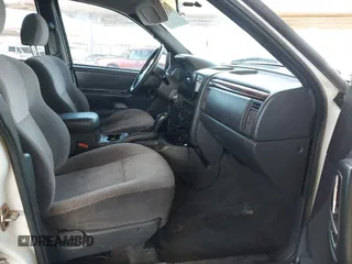 2000 Jeep Grand Cherokee Laredo z VIN 1J4GW48S4YC299149, wystawiony jako IAAI lot #42347792 z przebiegiem 229 007 mil mil oraz . Historia ofert i sprzedaży dostępna na DreamBid. Obrazek 5.