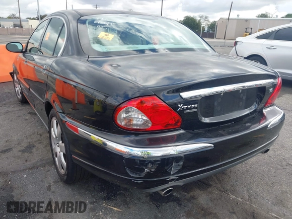 2004 Jaguar X-Type with VIN SAJEA51C44WD56659, listed as a IAAI auction lot 41712395 with Not Provided miles and . Bid and sale history available at DreamBid. Image 3.