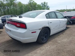2014 Dodge Charger Police with VIN 2C3CDXAT8EH216267, listed as a IAAI auction lot 42104131 with 116,299 mi miles and . Bid and sale history available at DreamBid. Image 4.