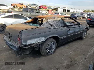 2001 Cadillac Eldorado ESC z VIN 1G6EL12Y81B110048, wystawiony jako Copart lot #69995914 z przebiegiem Nie podano mil oraz Nie do naprawy. Historia ofert i sprzedaży dostępna na DreamBid. Obrazek 3.