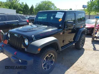 2015 Jeep Wrangler Rubicon Hard Rock with VIN 1C4BJWCG1FL610028, listed as a IAAI auction lot 42318569 with 48,627 mi miles and . Bid and sale history available at DreamBid. Image 2.