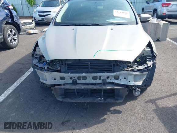 2015 Ford Focus SE z VIN 1FADP3F29FL206003, wystawiony jako IAAI lot #42187898 z przebiegiem 149 560 mil mil oraz . Historia ofert i sprzedaży dostępna na DreamBid. Obrazek 6.