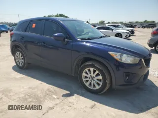2014 Mazda CX-5 Touring z VIN JM3KE2CYXE0327950, wystawiony jako Copart lot #51390585 z przebiegiem 129 523 mil mil oraz Czysty tytuł • Clean title. Historia ofert i sprzedaży dostępna na DreamBid. Obrazek 4.