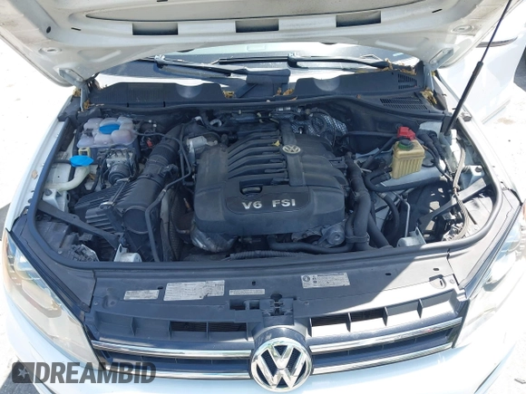 2012 Volkswagen Touareg Sport with VIN WVGEF9BP1CD008717, listed as a IAAI auction lot 42120641 with 211,580 mi miles and . Bid and sale history available at DreamBid. Image 10.