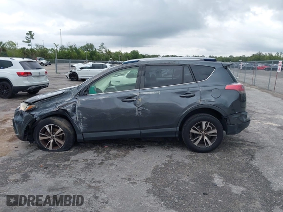 2017 Toyota RAV4 XLE with VIN JTMWFREVXHD096998, listed as a IAAI auction lot 41997925 with 119,564 mi miles and . Bid and sale history available at DreamBid. Image 14.