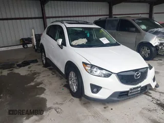 2014 Mazda CX-5 Touring with VIN JM3KE4CY9E0370610, listed as a IAAI auction lot 42016896 with 72,340 mi miles. Bid and sale history available at carsss.com. Image 1.