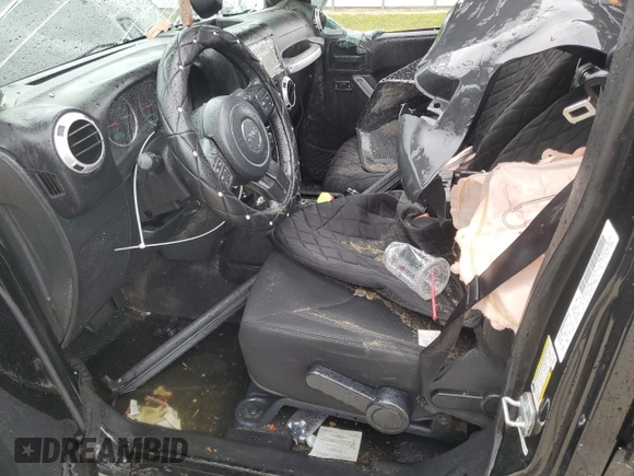 2014 Jeep Wrangler Unlimited Sahara z VIN 1C4HJWEG4EL305998, wystawiony jako Copart lot #56377275 z przebiegiem 60 597 mil mil oraz Szkoda całkowita • Salvage title. Historia ofert i sprzedaży dostępna na DreamBid. Obrazek 7.
