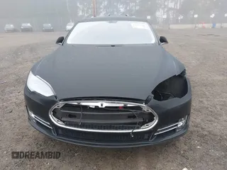 2014 Tesla Model S 60 with VIN 5YJSA1H1XEFP36008, listed as a IAAI auction lot 41287240 with 48,171 mi miles and . Bid and sale history available at DreamBid. Image 13.