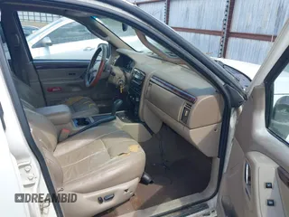 2002 Jeep Grand Cherokee Limited z VIN 1J4GX58N62C195783, wystawiony jako IAAI lot #42745397 z przebiegiem 242 502 mil mil oraz . Historia ofert i sprzedaży dostępna na DreamBid. Obrazek 5.