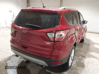 2017 Ford Escape Titanium z VIN 1FMCU9J9XHUC20359, wystawiony jako IAAI lot #41938688 z przebiegiem 79 743 mil mil oraz . Historia ofert i sprzedaży dostępna na DreamBid. Obrazek 4.