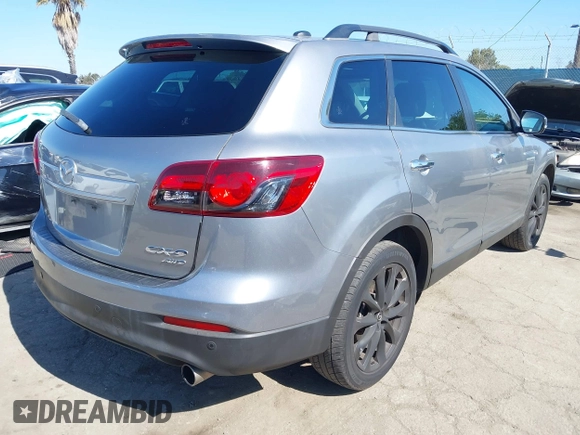 2014 Mazda CX-9 Grand Touring z VIN JM3TB3DV9E0437380, wystawiony jako IAAI lot #42298066 z przebiegiem 169 644 mil mil oraz . Historia ofert i sprzedaży dostępna na DreamBid. Obrazek 4.