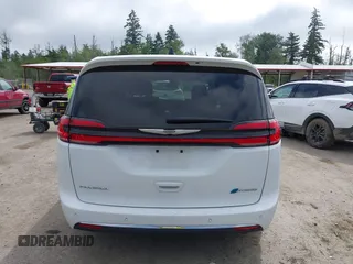 2023 Chrysler Pacifica Hybrid Touring L with VIN 2C4RC1L77PR541513, listed as a IAAI auction lot 42433421 with 53,979 mi miles and . Bid and sale history available at DreamBid. Image 17.
