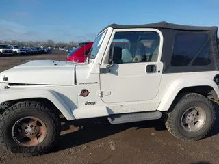 2002 Jeep Wrangler Sahara with VIN 1J4FA59S62P772256, listed as a IAAI auction lot 41968844 with 170,218 mi miles. Bid and sale history available at carsss.com. Image 14.
