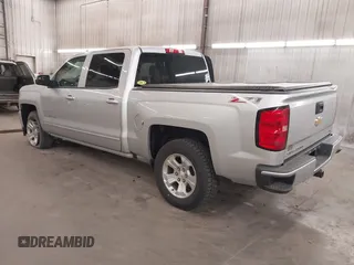 2017 Chevrolet Silverado 1500 LT with VIN 3GCUKREC5HG318772, listed as a IAAI auction lot 42056116 with 82,987 mi miles and . Bid and sale history available at DreamBid. Image 3.